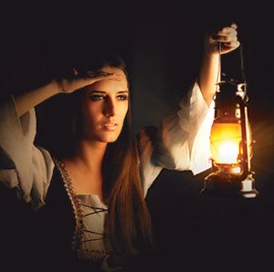 Lady holding a lap, the sun turned dark